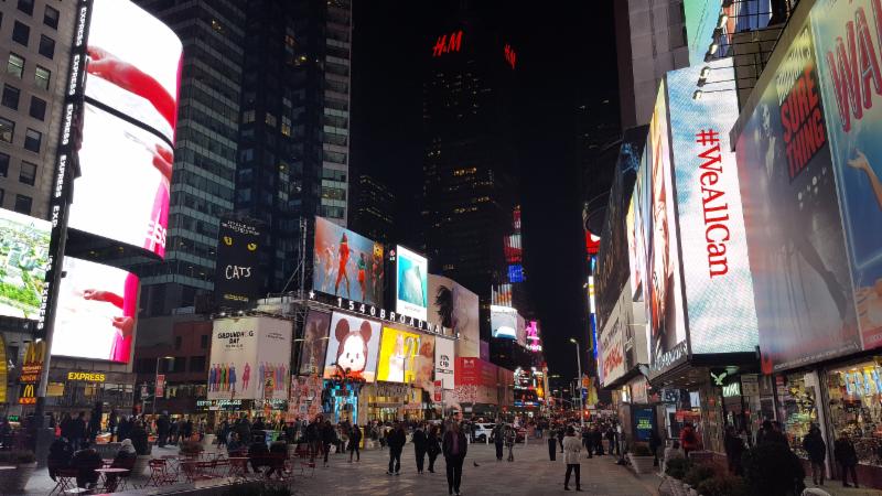 Times Square bustling with energy, showcasing marketing strategies in action