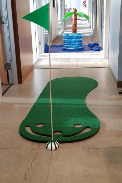 Image showcasing office golf as a creative method for strengthening team bonds and building trust