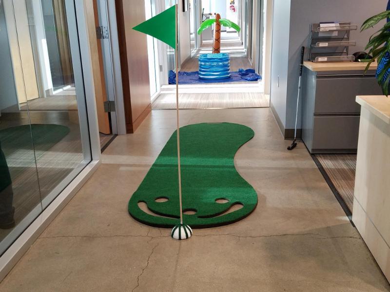 Image showcasing office golf as a creative method for strengthening team bonds and building trust