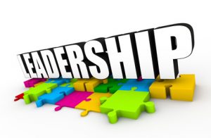 Illustration depicting the four leadership essentials: integrity, vision, communication, and performance management