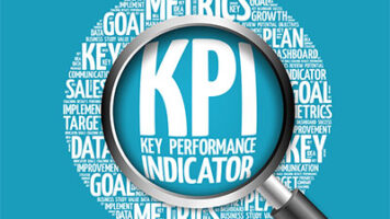 Image of magnifying glass over KPI indicators, highlighting proactive risk management and opportunity identification strategies