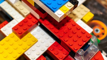 Illustration depicting the complexities of 'Sustainability vs. Technology' for Lego